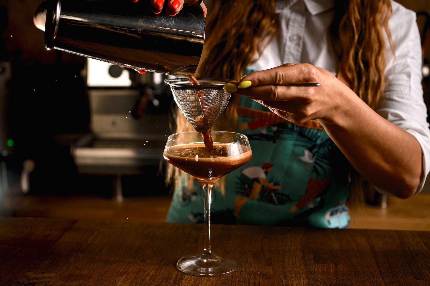 Bartender Pouring a Cocktail - Apres Handcrafted Libations