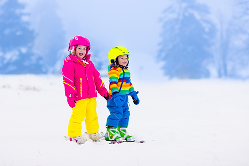 Happy kids skiing